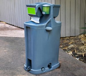 hand wash station on a concrete pad
