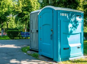 ada porta potty in a park